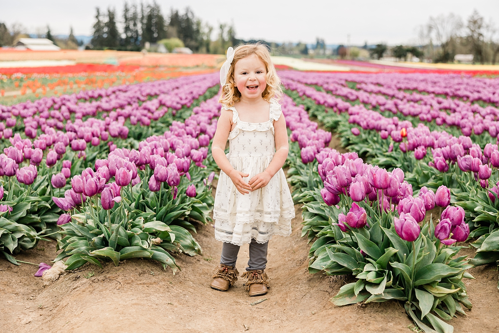 Child in a field of flowers Hoot-N-Annie Portland