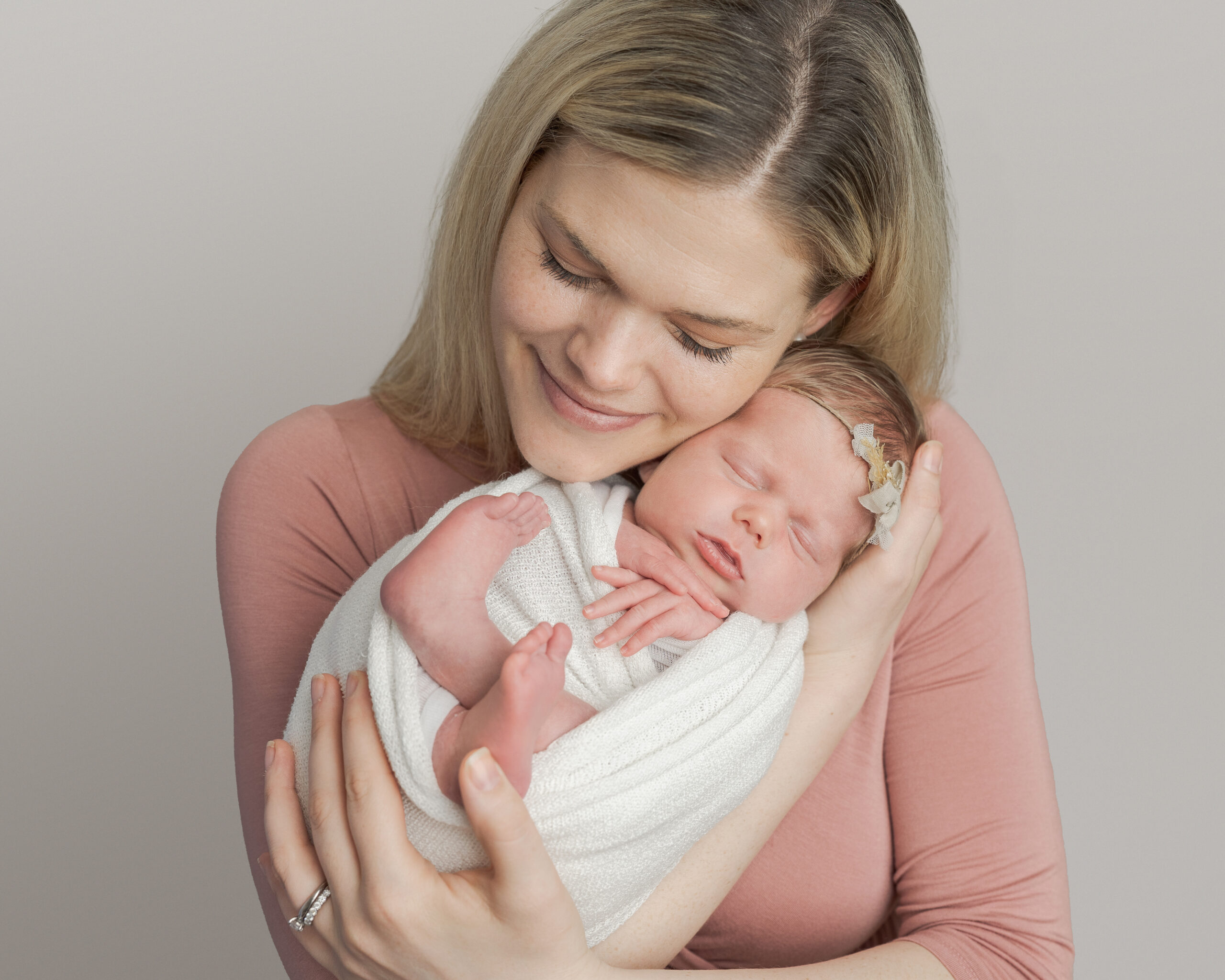 Mom snuggling new baby girl Alma Midwifery Portland