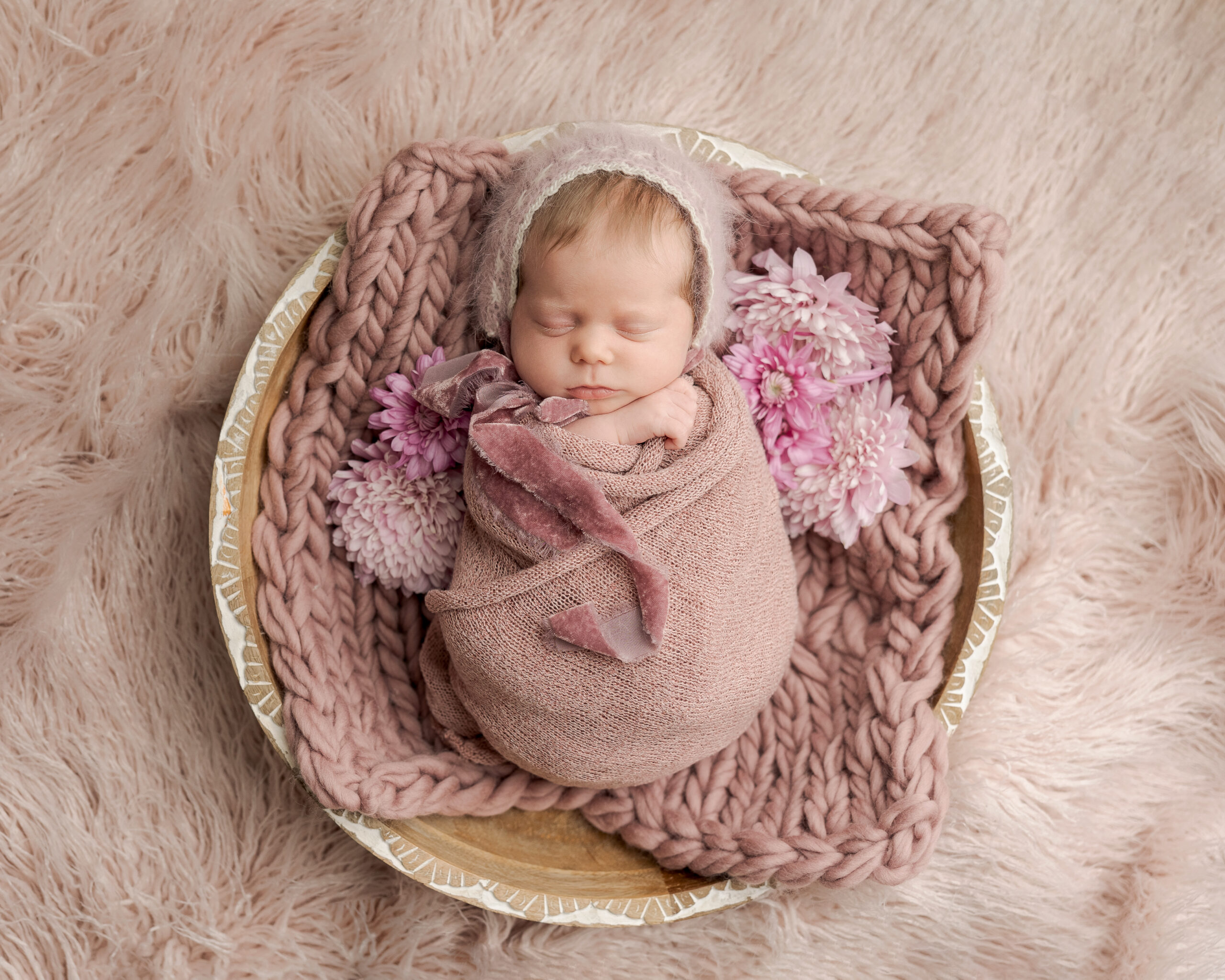 baby girl wrapped in pink in a basket Hearth and Home Midwifery