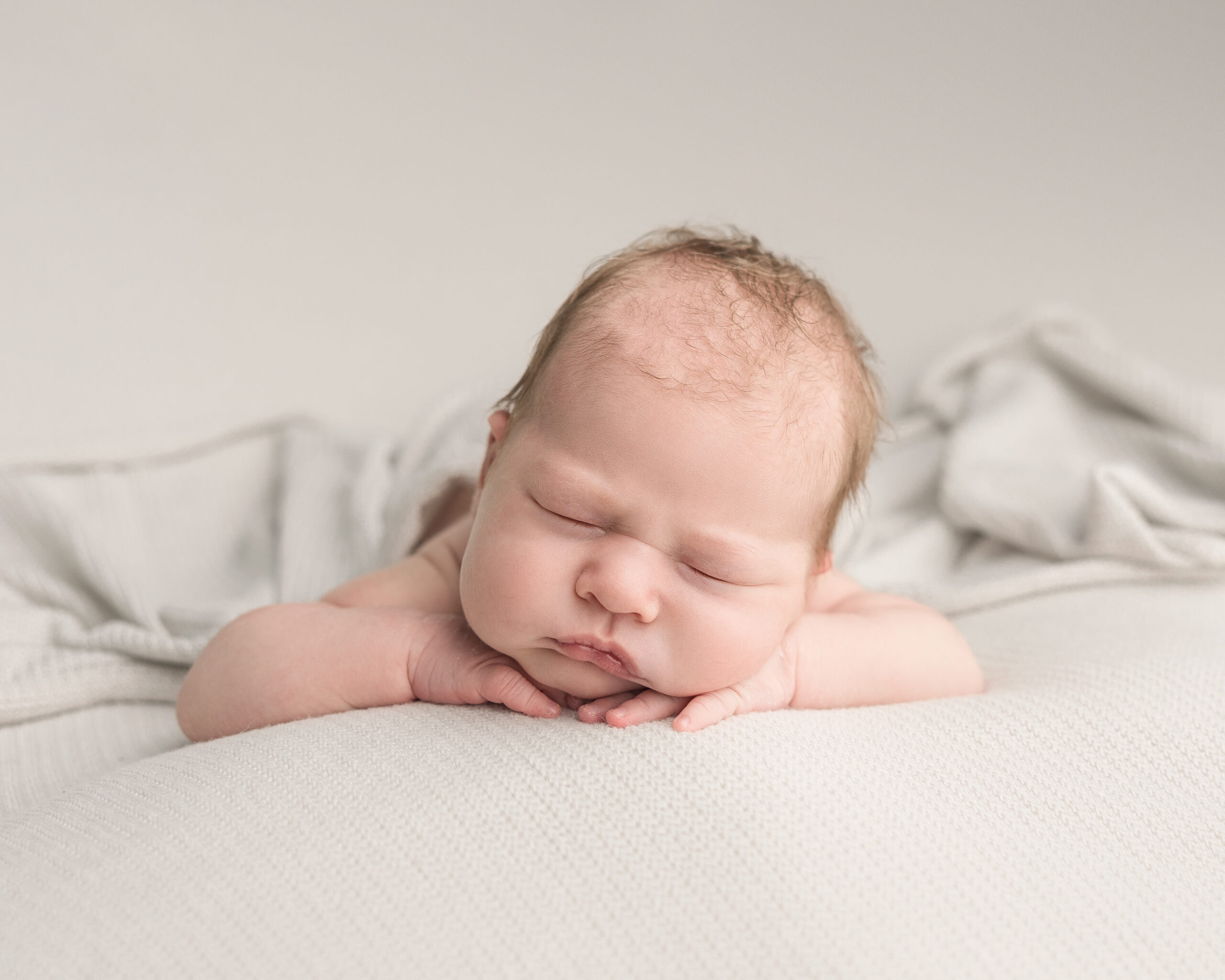 baby with head resting on hands lactation consultants portland