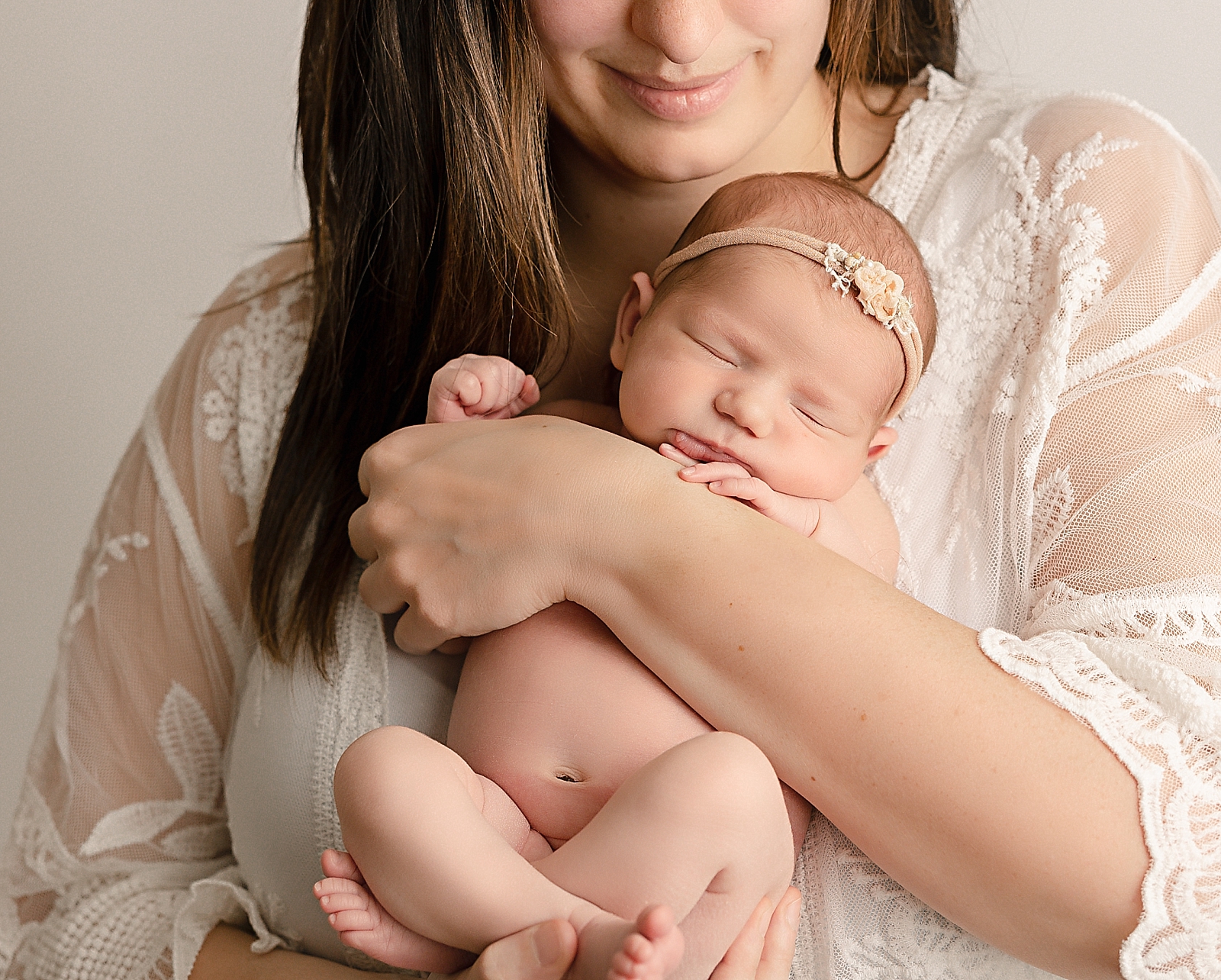 mom holding newborn lactation consultants portland
