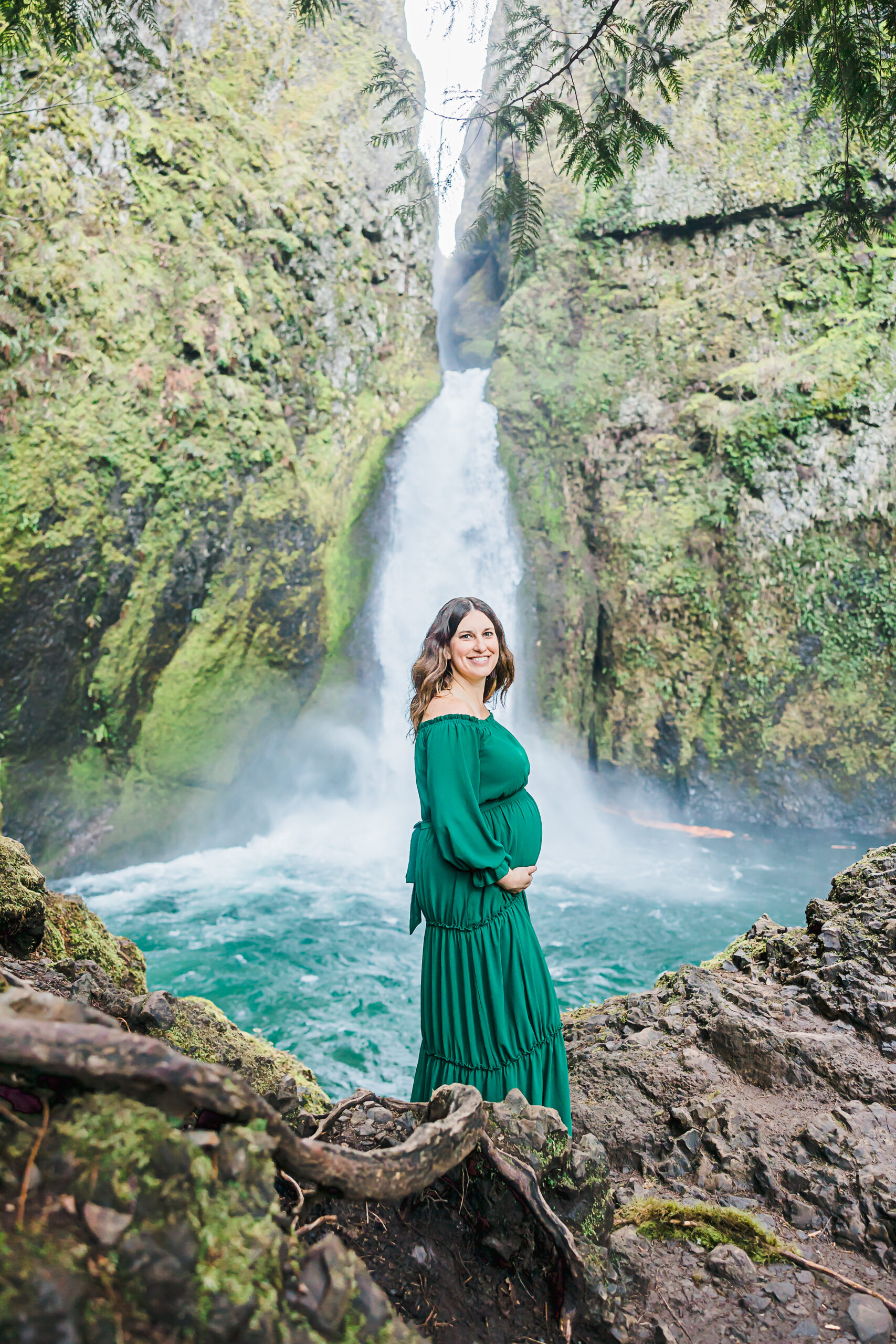 pregnant mom standing in front of a waterfall OHSU Birthing Center