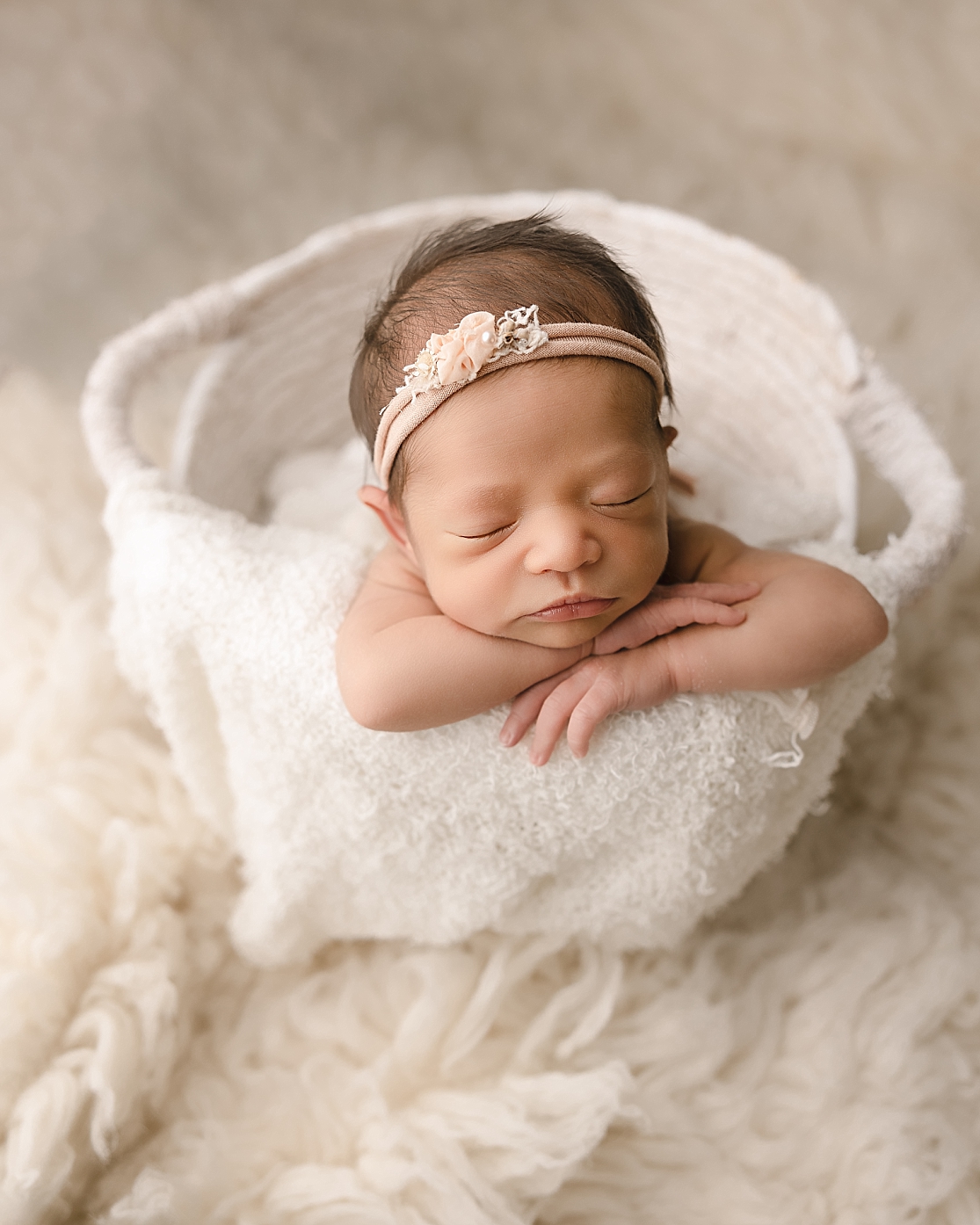 newborn baby girl sleeping in a basket Andaluz Waterbirth Center