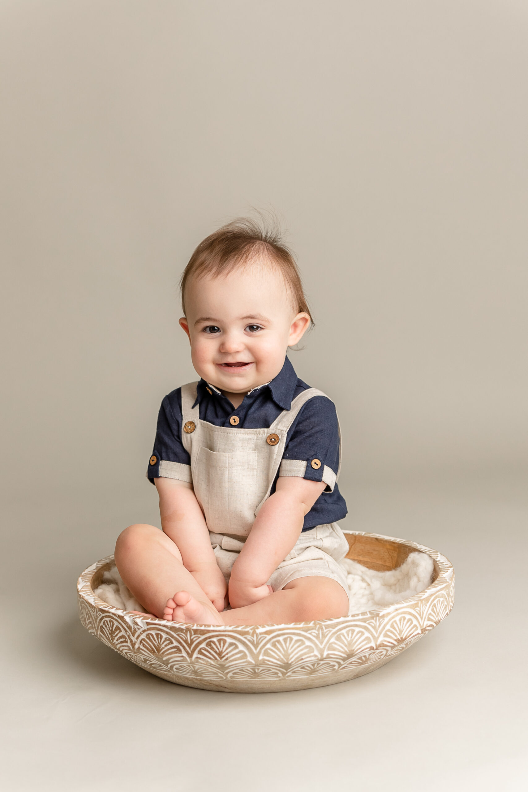 little boy in khaki overalls sitting in a bowl Pinwheels Resale