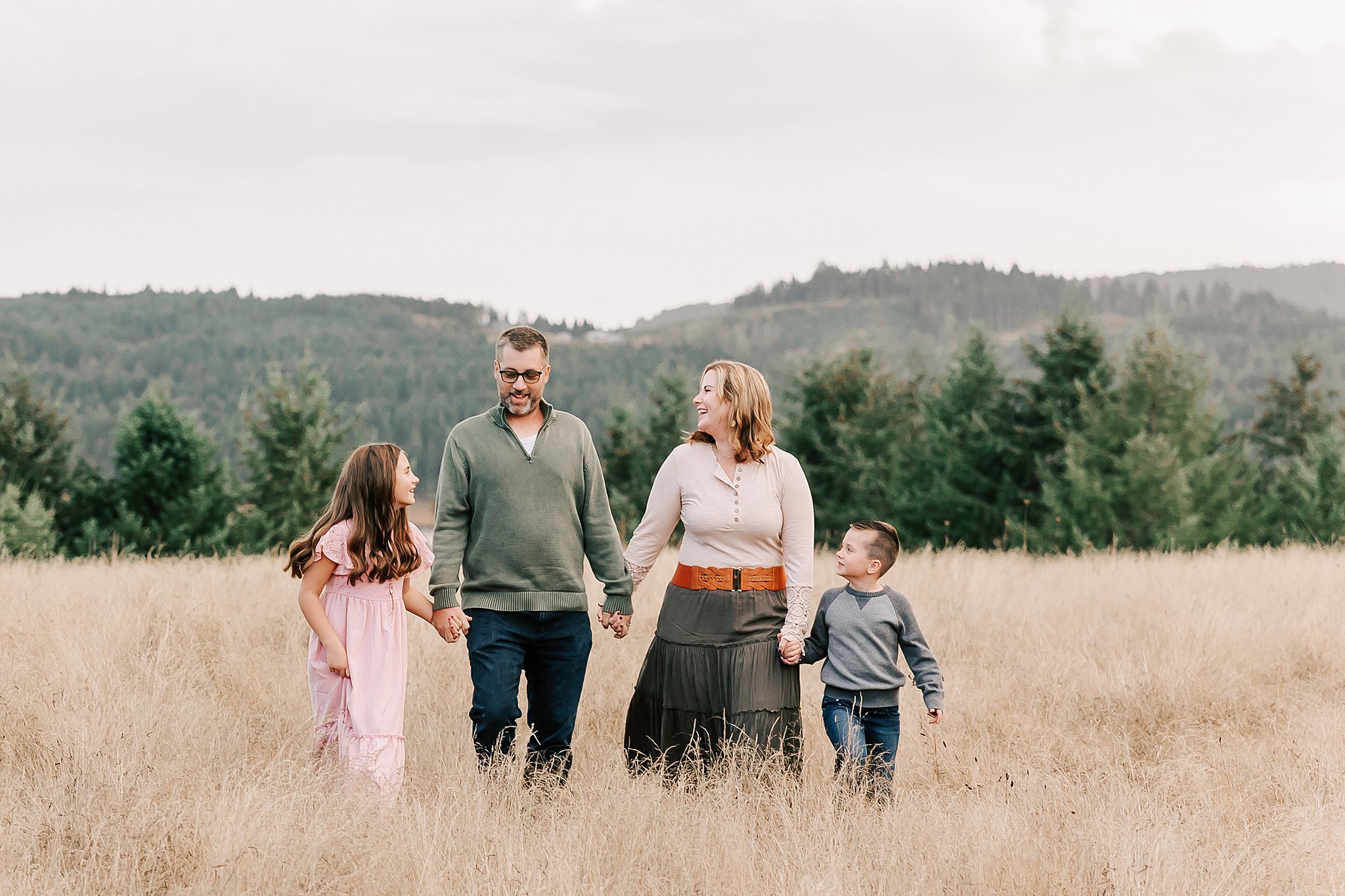 family of four walking through a field in Beaverton