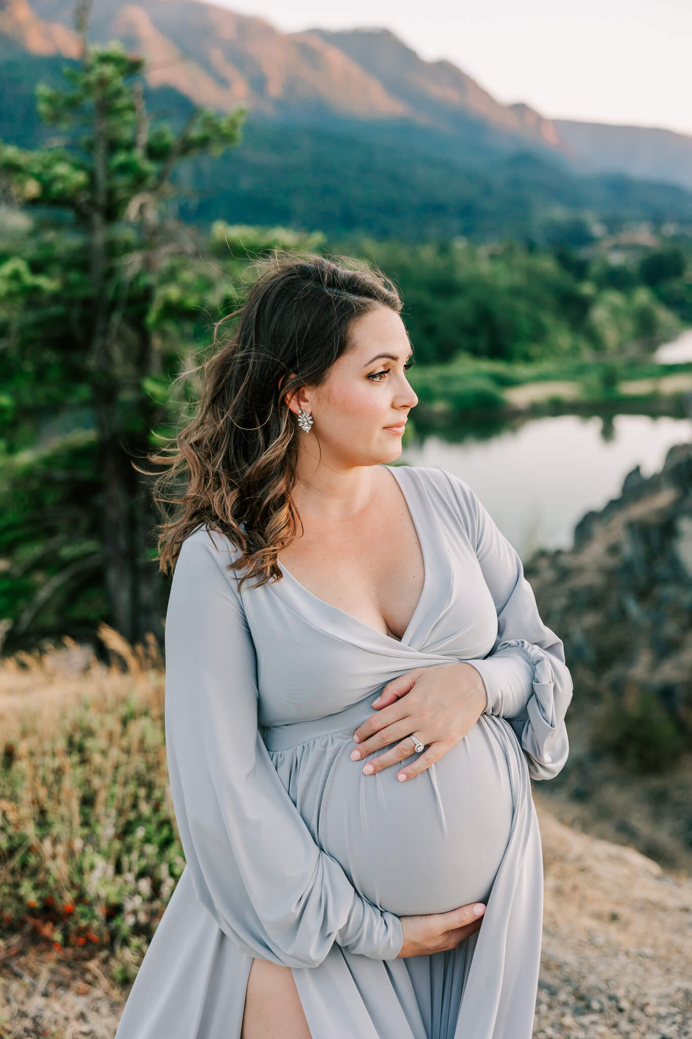 pregnant mom in silver dress for portland prenatal massage